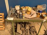 a workbench with tools on top of it in a room