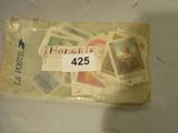 a package of stamps on a table with a price tag