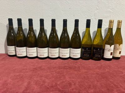several bottles of wine are lined up on a table