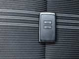 an image of a close up of a remote control on a car seat