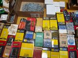 many boxes of assorted items sitting on a table