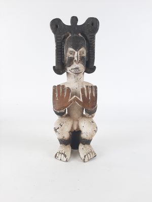figurine in the form of a woman with horns on her head
