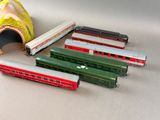 several toy trains are lined up next to each other on a table