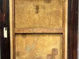 an old picture of a wooden frame with a painting on it
