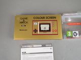 a box with a game on it and a card next to it