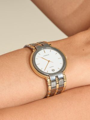 JEAN LASSALLE Montre de ville en acier et métal doré à mouve…