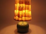 a lamp that is sitting on a table in a room