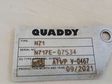 a tag that says quaddy on it on a table