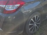 a car that is parked on the grass in the field