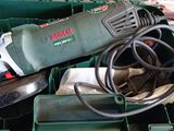 a green box with tools in it on the floor