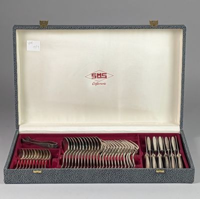 silverware in a case with a red lining on a gray surface