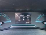 the dashboard of a car with a digital display on it