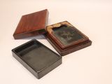 three small wooden boxes with a picture in them on a white surface