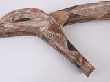a piece of wood that has been made to look like a bird