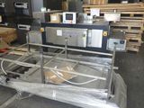 a machine that is sitting on a cart in a warehouse