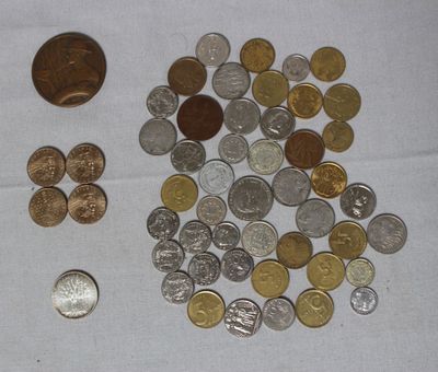 a pile of coins sitting on a table next to a coin