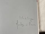 a book with writing on it sitting on a table