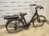 a bike that is parked in front of a wall
