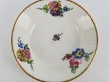 a close up of a plate with flowers on it
