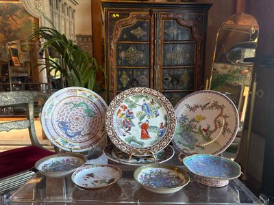 a lot of plates that are sitting on a table