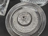 a glass plate and a glass bowl on a table