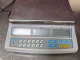 an image of a scale on a table in a kitchen