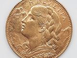 l'image d'une pièce d'or sur laquelle figure le visage d'une femme