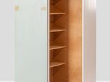 a white metal cabinet with shelves and shelves in the middle