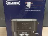 packaging of delonghi coffee machine sitting on a wooden table