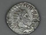 a close up of a coin with a man ' s face on it