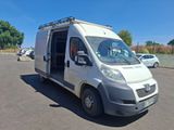 a white van that is parked in a parking lot