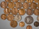 a lot of coins that are sitting on a table