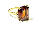 an image of a ring with a large brown stone in it