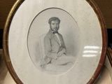 a picture of a man sitting in a chair in a picture frame