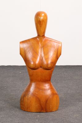 an image of a wooden mannequin sitting on top of a floor