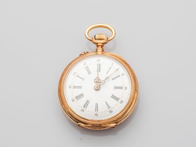 an antique gold pocket watch with roman numerals and roman numerals