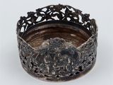 an old silver plate with a crown on it