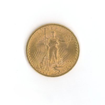 une image d'une pièce d'or sur une surface blanche
