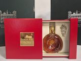 a bottle of louis xiii in a red box on a table