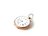 a small gold pocket watch with roman numerals on it