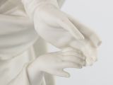 a statue of a woman holding a bird in her hands