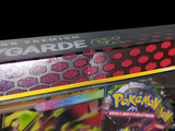 a box of pokemon cards on display on a table
