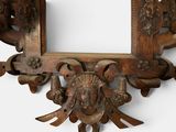 a picture of a wooden frame with a face on it