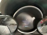 a close up of a car dashboard with a speedometer