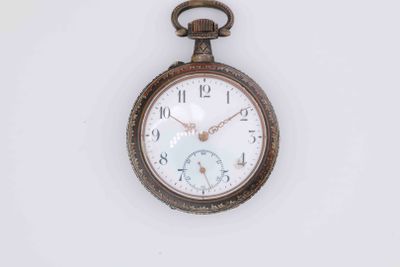 a pocket watch that is hanging on a wall