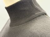 a close up of a mannequin wearing a turtle neck sweater
