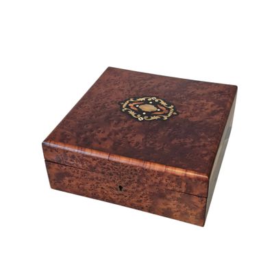 an image of a wooden box with a decorative design on the lid