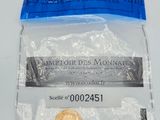a small coin in a plastic bag on a table