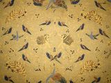 a picture of a rug with birds and flowers on it
