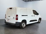 a white van that is parked in a room